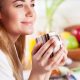 Picture of a Lady Drinking a cup of coffee