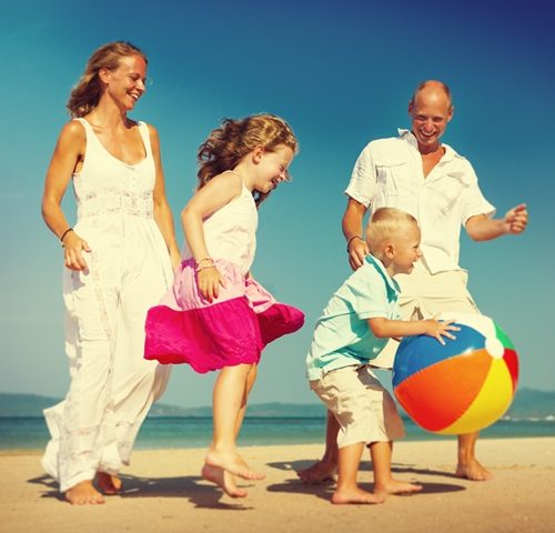 Family on the beach near The Macleay Potts Point