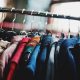 Clothes hanging on a clothes rack at a shop near The Macleay Sydney